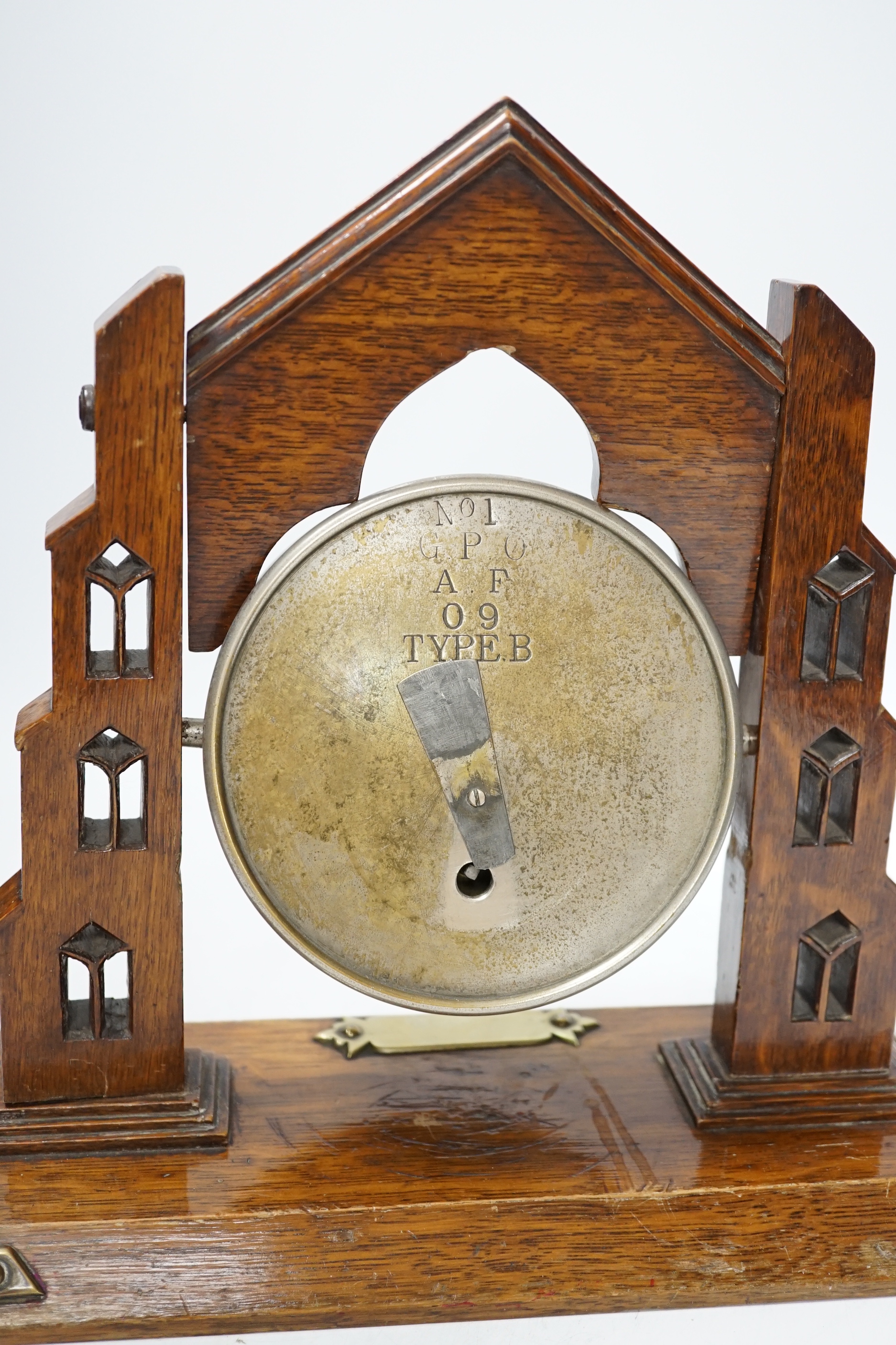 A G.P.O. timepiece and oak stand, 30cm wide